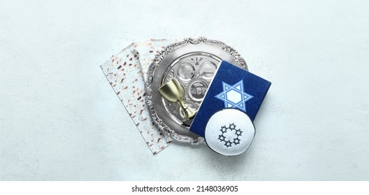 Passover Seder Plate, Kippah, Torah, Matza And Cup On Light Background  