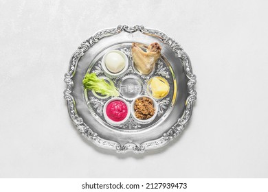 Passover Seder Plate With Traditional Food  On White Background