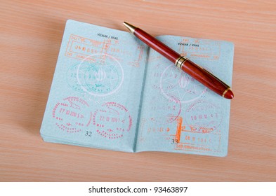 Passport with airport stamps - Shutterstock ID 93463897
