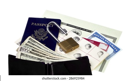 Passport, Fingerprint Card, Driver's License, Social Security Card And Birth Certificate Isolated On White With A Wallet And US Currency And An Unlocked Padlock 