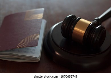 Passport And Judge's Gavel. International Law, Immigration Law And Citizenship Rights Concept