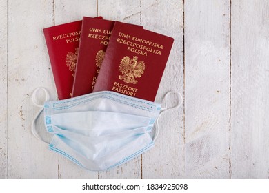 Passport And Mask For Health Protection. International Travel Restrictions. Dark Background.