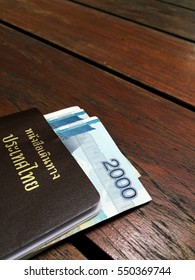 Passport And Money On Wood Table Background 