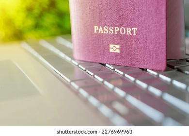 Passport on the keyboard. The concept of online identification when registering on a website on the Internet. Internet by passport. Purchase of plane tickets. Hotel booking. - Shutterstock ID 2276969963