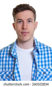 Passport picture of a guy in a checked shirt