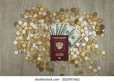 Passport Of The Russian Federation, US Dollars, Lie On The Coins. Top View.