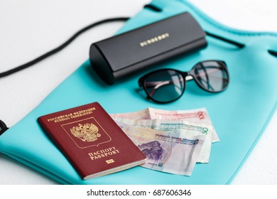 Passport, Sunglasses, Case, Money, Backpack Lying On White Background