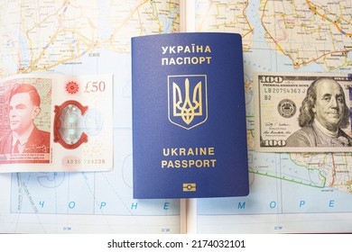 Passport Of Ukraine On The Background Of The Map, Seeking Asylum Abroad. Migration Crisis In Ukraine