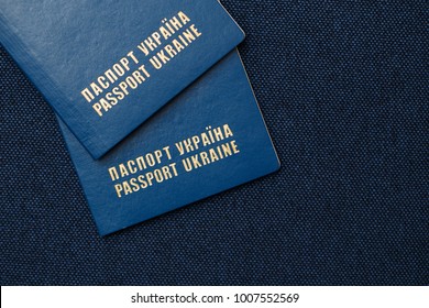 Passport of Ukraine on a blue background.