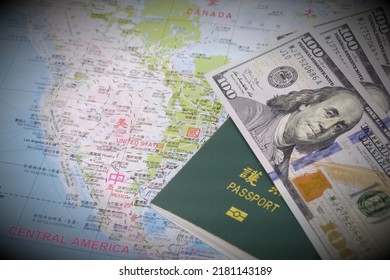 A Passport And US Dollars On The Map Of America. Words On Passport Are 