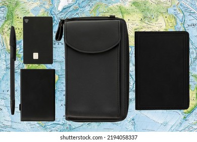 Passport Wallet Pen Credit Card Black On The Background Of The World Map