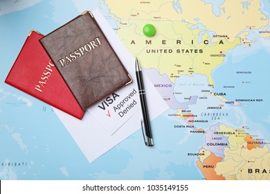 Passports And Pen On Map. Approved American Visa