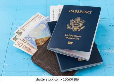 Passports And Wallet With Dollars, Euro And Credit Card On A Map Background. Travel Concept.