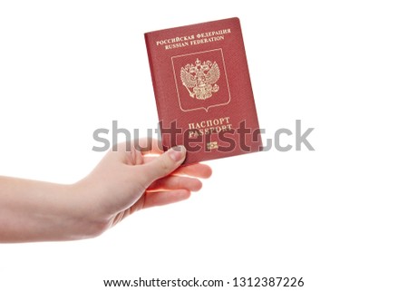 passports in women's hands on white background