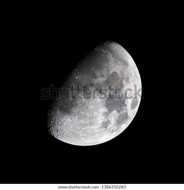 Past first quarter (half moon) slightly gibbous\
Moon with crater detail