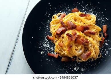 Pasta alla carbonara, traditional recipe of spaghetti with guanciale, egg, pecorino and black pepper of roman cuisine, italian food, european gastronomy  - Powered by Shutterstock