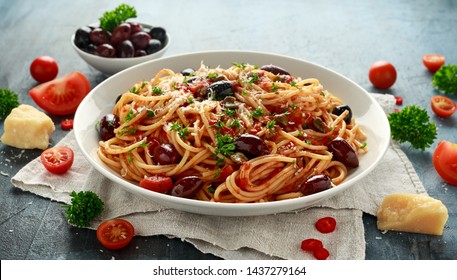 Pasta Alla Puttanesca with garlic, olives, capers, tomato and anchois fish - Shutterstock ID 1437279164