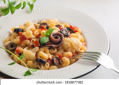 Pasta With Anchovy, Cauliflower, Olives And Tomatoes, Close Up. 
