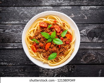 Pasta Bolognese With Tomato Sauce, Ground Minced Beef, Basil Leaves On Background