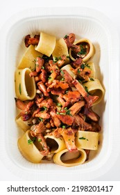 Pasta With Chanterelle Mushrooms In A Plastic Takeout Container