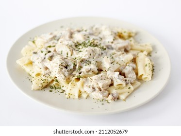 Pasta With Chicken And Mushrooms In Creamy Cheese Sauce On A White Background