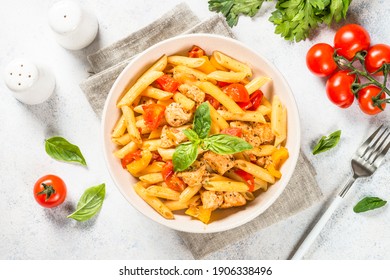 Pasta With Chicken And Vegetables With Fresh Herbs. Traditional Italian Food. Top View At White Table.