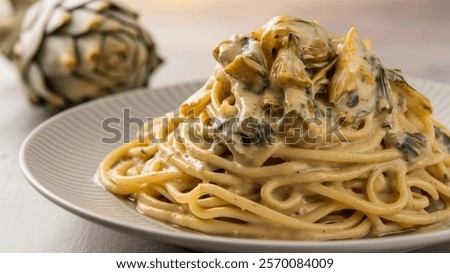 Pasta con Crema di Carciofi - Pasta with Artichoke Cream: Silky pasta tossed in a creamy artichoke sauce, a delightful dish for lovers of Mediterranean flavors.