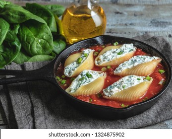 pasta conchiglioni stuffed spinach and cheese, tomato sauce cooked
