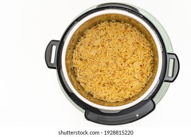 Pasta Cooked In Instant Pot. Delicious Orzo Pasta Close Up In A Pot On White Background With Copy Space Directly From Above