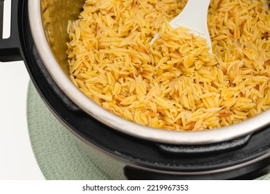 Pasta Cooked In Instant Pot. Delicious Orzo Pasta Close Up In A Pot On White Background With Copy Space