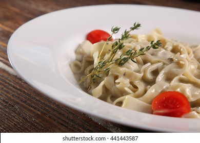 Pasta With Creamy Cheese Sauce On Plate