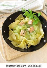 Pasta With Cucumber And Salmon In Wok