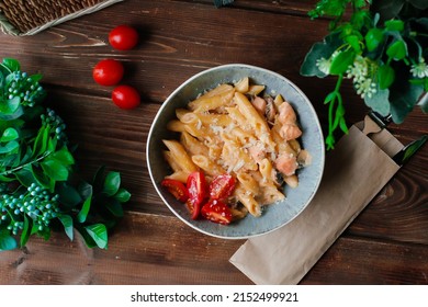 Pasta Dish Made With Vodka And Penne Pasta, With Heavy Cream, Crushed Tomatoes, Onions, And Sausage, Pancetta. Top View