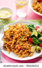 Pasta Fusilli With Ground Beef And Tomato Sauce Served With Fresh Salad