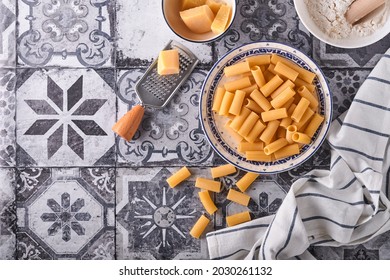 Pasta. Italian Pasta. Rigatoni And Vegetables Cooking Ingredients On An Old Stone Background. Italian Food Cooking Ingredients. Top View With Copy Space.