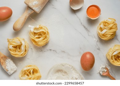 Pasta making Ingredients. Flour, eggs and rolling pin on marble background. Top view with copy space - Powered by Shutterstock