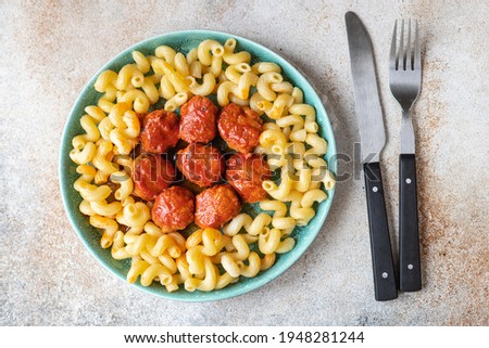 Similar – Image, Stock Photo Meatballs in tomato sauce on black tray. Above view of meat dish