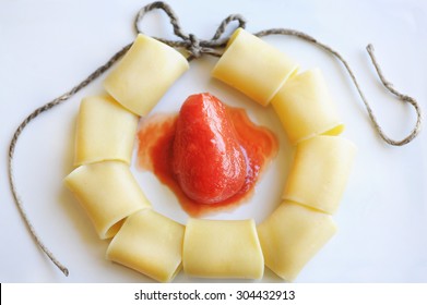 Pasta. Necklace Of Macaroni Pasta With Tomato.