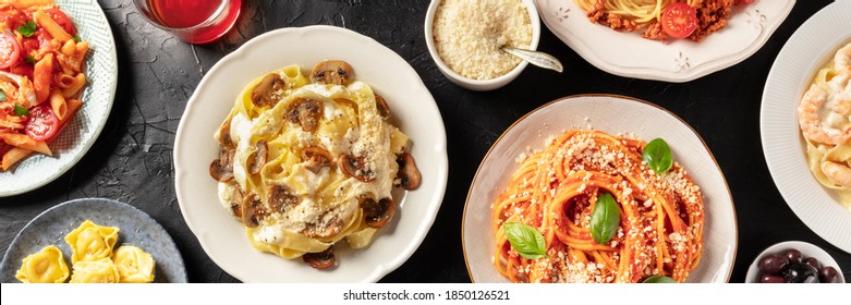 Pasta. Overhead Panoramic Shot Of Traditional Italian Dishes. Mushroom Pappardelle, Tomato Spaghetti, Ravioli, With Grated Parmesan Cheese On A Black Background