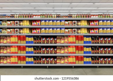 Pasta packing on a shelf in a supermarket. is suitable for presenting new packaging among many others. - Shutterstock ID 1219556386