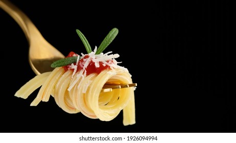 pasta with parmesan cheese and tomato sauce on golden fork - Powered by Shutterstock