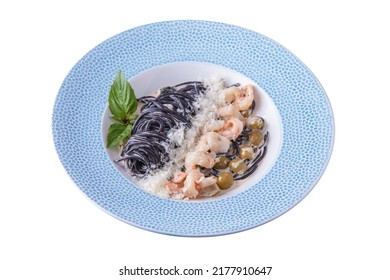 Pasta With Parmesan, Shrimp Basil, Olives And Mushroom Sauce In A Plate On A White Plate