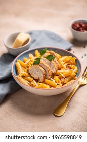 Pasta Penne With Cajun Sauce And Fried Chicken Prepared For Dinner