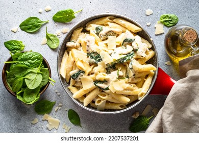Pasta penne with chicken and spinach in creamy sauce. - Shutterstock ID 2207537201