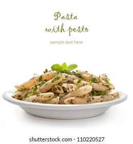 Pasta With Pesto Sauce, Fresh Basil And Nuts On White Plate