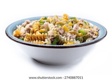 Pasta salad with tuna, corn and olives in bowl isolated on white background