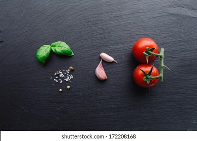 Pasta Sauce Ingredients Concept On Black Slate Background Viewed From Top