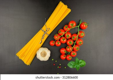 Pasta Sauce Ingredients Concept On Black Slate Background Viewed From Top