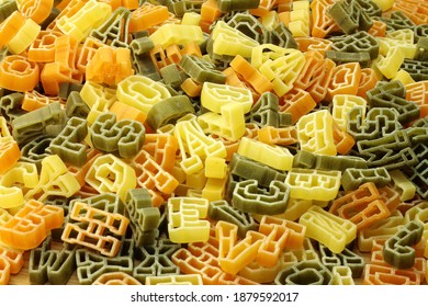 Pasta in shape of alphabet for background.