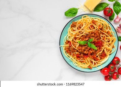 Pasta Spaghetti Bolognese On A Blue Plate On White Marble Table. Healthy Food. View From Above With Copy Space